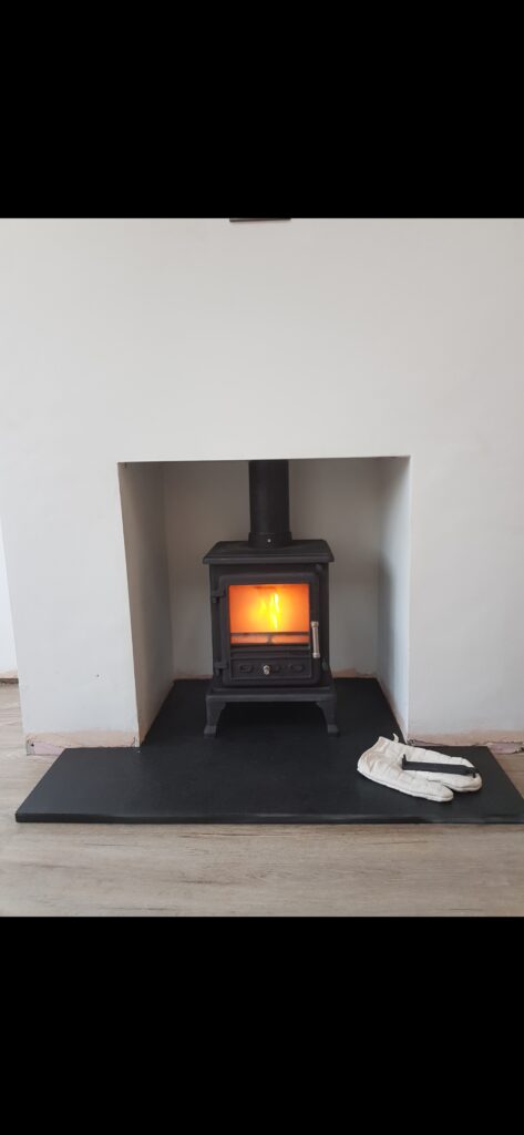 Hopkins Log Burners Installation of Clarke Firefox 5 5KW Multifuel Stove in Resolven, Neath including black hearth and midtherm 316 flexi liner.