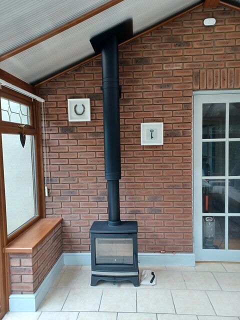 New installation by Hopkins log burners in consevatory of property in Llanelli- Ecosy Rock 5 Lux 5KW Mi Black Twin Wall