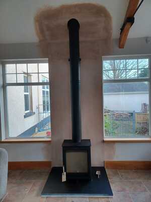 Multifuel-Stove-Mi-Black-Twin-Wall-Install-in-Sun-Room-Newton-Mumbles-Hopkins-Log-Burners