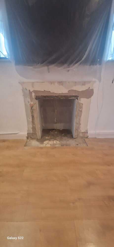 Fireplace-recess-boarded-and-squared-off-in-readiness-for-laying-hearth-for-Multifuel-Stove-and-Oak-Mantel-Installation-Pontardawe-Swansea-Valley