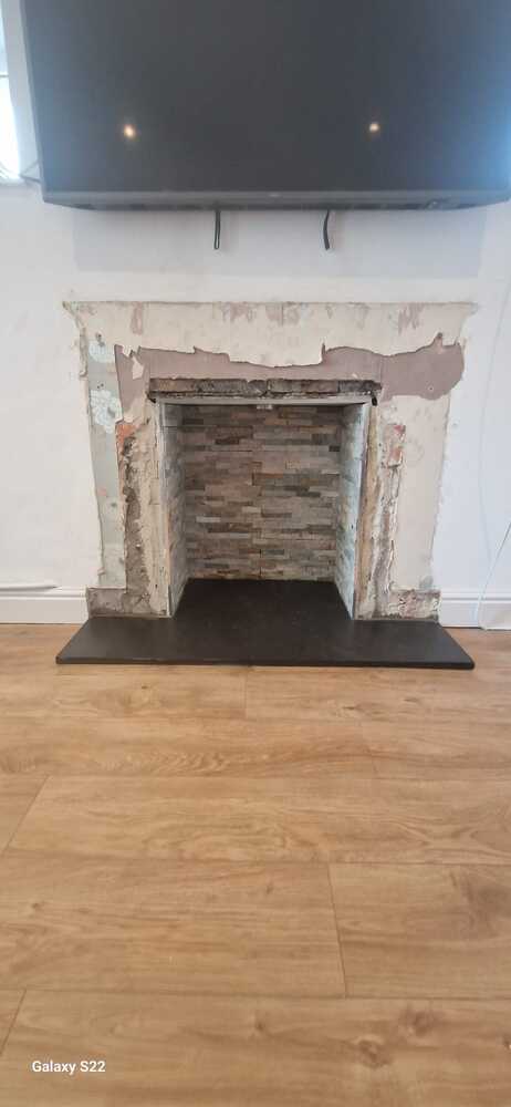 Split-faced-tiles-laid-in-fireplace-recess-for-Multifuel-Stove-and-Oak-Mantel-Installation-Pontardawe-Swansea-Valley