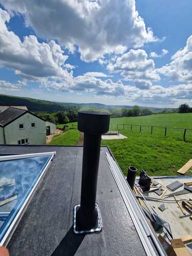 5 inch Twin wall Flue Installation Through a Rubber Flat Roof at farmhouse in trebanos swansea valley hopkins log burners