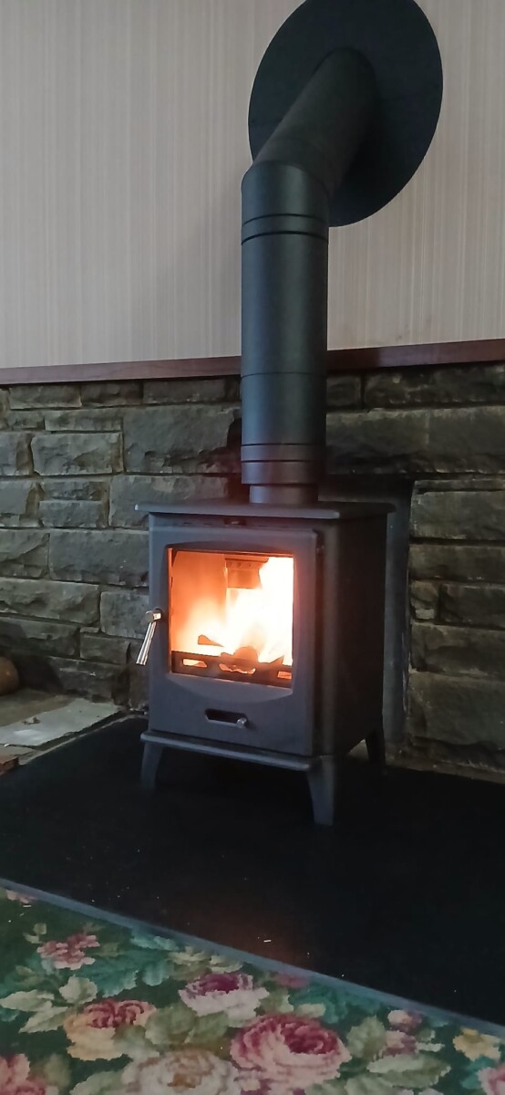 side view of Fire glowing in F2 Acona Slider multifuel stove installation- Pontrhydyfen, neath Port Talbot-Hopkins Log Burners