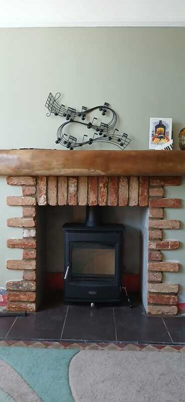 Completed Henley Glenwood multifuel stove installation by Hopkins Log Burners in Clydach, Swansea - full fireplace view with decorative mantel beam